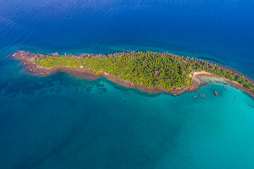 Green forest island sea with turquoise water