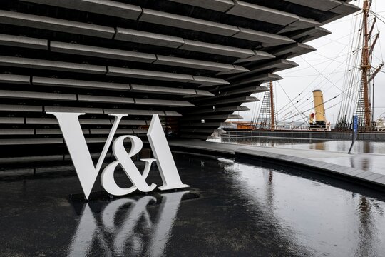 The logo of V and A Art Design Museum in Dundee, Scotland with a water pool in front of it