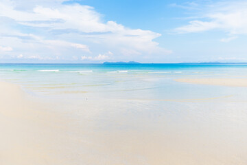 Fototapeta na wymiar White sand empty sea beach sunny day blue sky