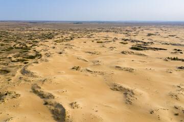 Fototapeta na wymiar Aerial view of sand dunes on the bank of Don river (so called Donskaya Sahara). Rostov Oblast, Russia.