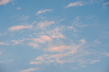 Beautiful summer sunset, pink clouds on the blue sky