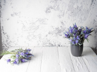 Laconic gray background with planters and lavender.