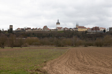 View over a field of the city wall and the town of Bad Wimpfen in spring