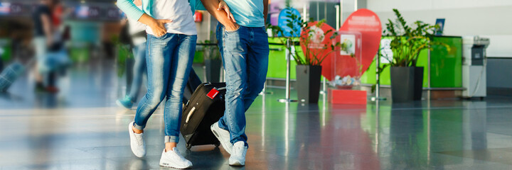 happy family hugging at airport