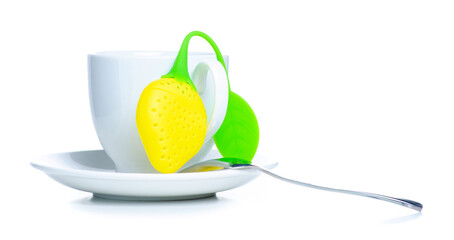 silicone teapot with white cup of tea on white background isolation