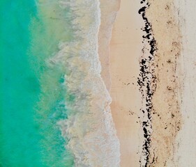 Fototapeta na wymiar Beautiful Green Turquoise Waves on Beach Line