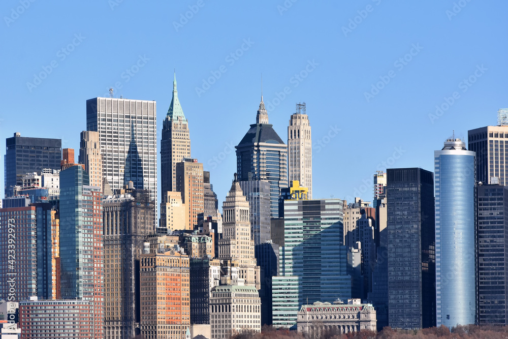 Poster Buildings architecture of Manhattan, New York City seen from Ellis Island, New Jersey, USA.