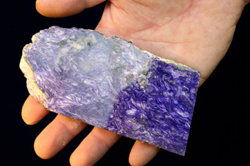 Man hands holding semi precious stone mineral