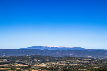 Fototapeta na wymiar Large panorama of the countryside in provence with the mont Ventoux in background and a nice cloudless sunny day