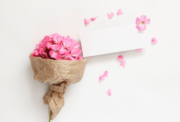 Spring bouquet of pink flowers on a light background with space for text.