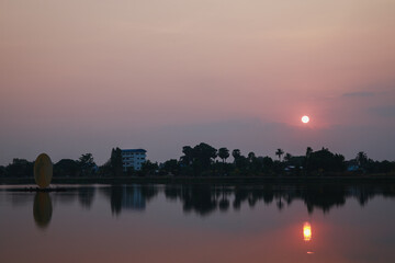 Fototapeta premium Sunset, sunrise with clouds, light rays on field at countryside Thailand