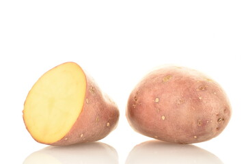 Two halves of unpeeled raw potatoes, close-up, isolated on white.