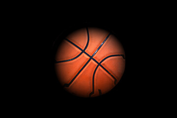 closeup of basketball ball on black background.