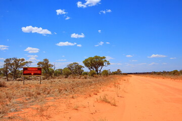 Road sign to Australian Aboriginal community in outback