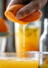 Orange juice dripping from a orange 