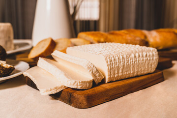 Homemade goat cheese is served for breakfast. Organic dairy products. Close up.
