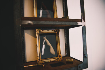man goes to a vintage barber shop to cut his hair, the bicycle is an ornament or is the owner's means of transportation