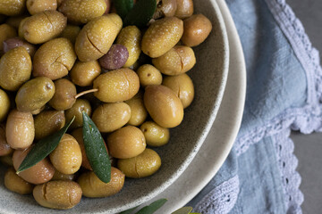 Marinated olives with herbs and spices, healthy natural food ingredients