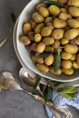 Marinated olives with herbs and spices, healthy natural food ingredients