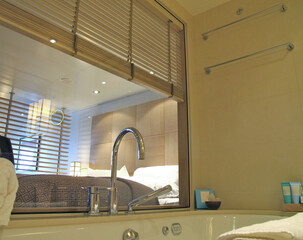 Modern design interiors inside bathroom with bathtub double vanity sink, glas shower, mirror,...