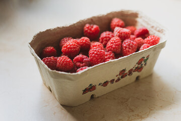 a basket of fresh juicy red raspberries