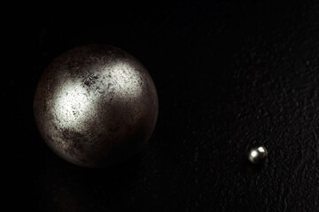 Obraz na płótnie Canvas Two metal spheres of different sizes isolated on a white background.