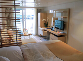 View into elegant clean modern design futuristic minimalistic ocean view suite with balcony,...