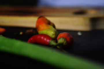 Chili Peppers on black background. herbs in the kitchen