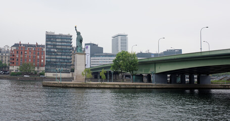 Fototapeta na wymiar The swan island became a haven for a smaller Statue of Liberty. The copper lady, 11.5 meters high, peers at the distant shores of the American continent