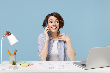 Young successful employee business woman in casual shirt sit work at white office desk with pc...