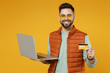 Young freelancer successful smiling happy copywriter caucasian man 20s wear orange vest mint...