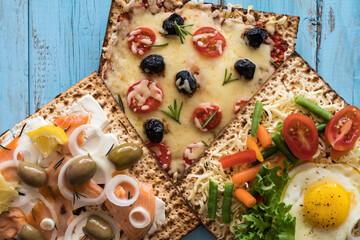 Matzah Sandwiches on blue wooden background. Food for Jewish holiday Pesach.