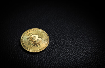 Selective focus on bitcoin with black low light shooting for cryptocurrency money for future trading using finace