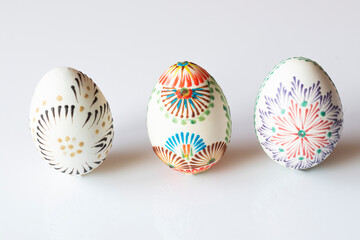 Three colorful Easter eggs on a white background 
