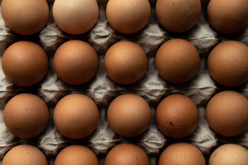 Large hen eggs on a cardboard carton