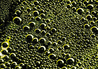 Drops of water on a black surface. The condensate. Top view. Free space.