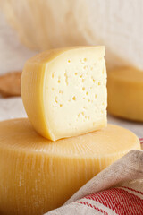 Pieces of  fresh homemade cheese on a tray close up