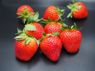 strawberries on black background