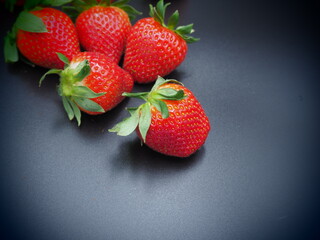 strawberries on a black background
