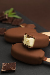 Glazed ice-cream on sticks in studio