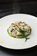 Risotto with seafood on white plate 