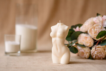 Fototapeta na wymiar Beautiful candle in the shape of a human body