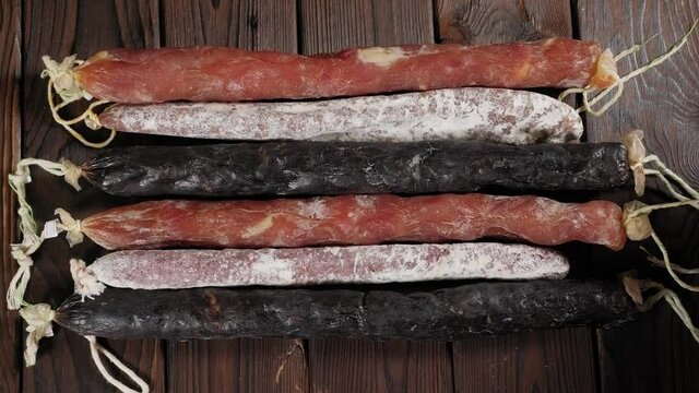 Traditional sausage and sausage with mold. Sausage salami on wooden board.