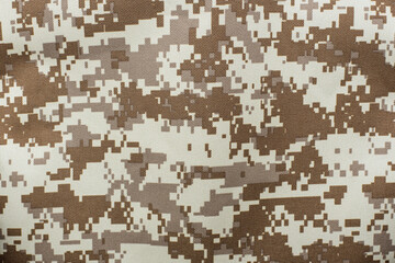 The pattern of protective military clothing on the fabric, in such a disguise of a soldier is difficult to see in the woods or in the field