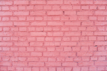 Texture of a pink brick wall at home.