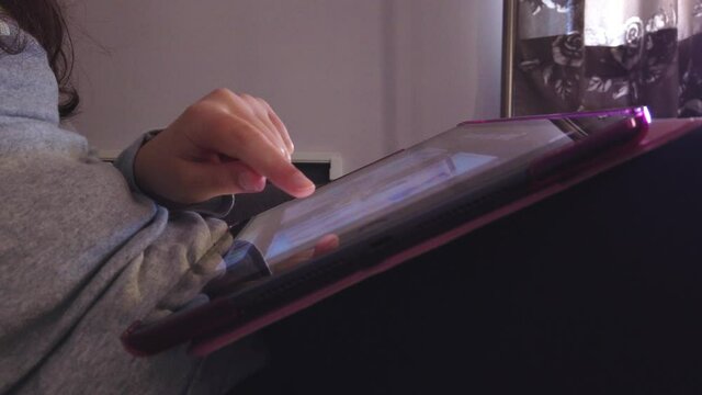 Girl playing on a tablet	