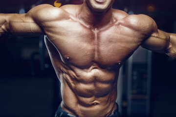 fit man training abs muscles at gym.