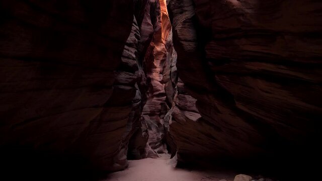 Mysterious Deep Slot Canyon With Wavy And Smooth Orange Red Stone Rock Walls