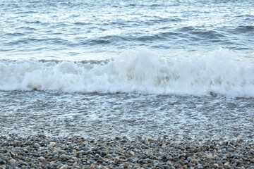a wave approaching the shore filmed in the evening