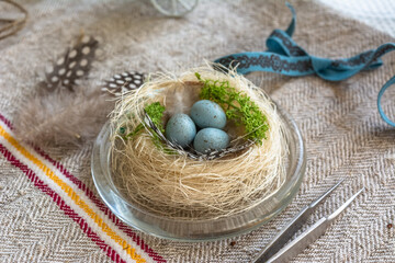 Easter wreath with a birdhouse and eggs